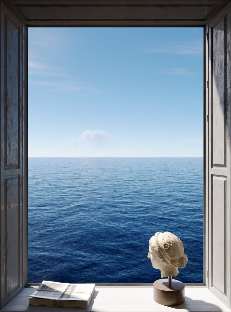 Open window with ocean view, featuring a bust sculpture and a book on the windowsill. Calm blue sea and clear sky.