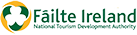Failte Ireland logo with green text and a shamrock emblem, representing Irish tourism.